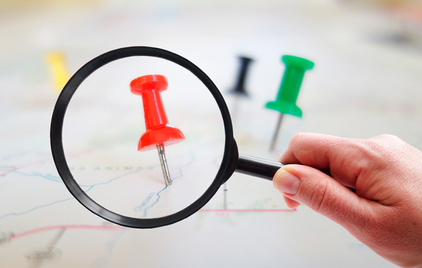 magnifying glass on map